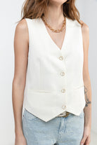 Gilet sans manches boutons dorés chic| Elora